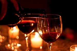 red-wine-pouring-into-a-second-glass-of-wine-in-candlelight-by-Gajen-Indra-2010