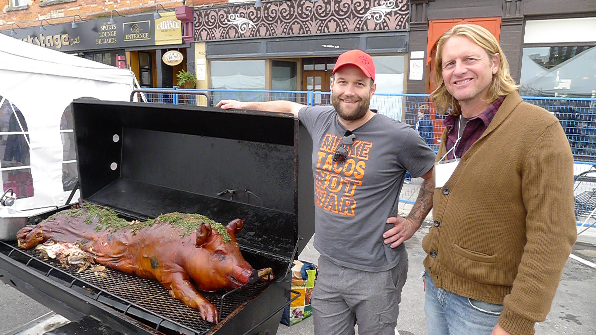 Chef Nick Benninger and Farmer Mark Lass proudly show off their very special pig roast.