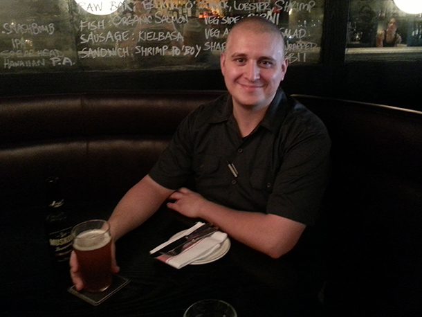 Jesse Vallins enjoying a beer at The Saint, Toronto.