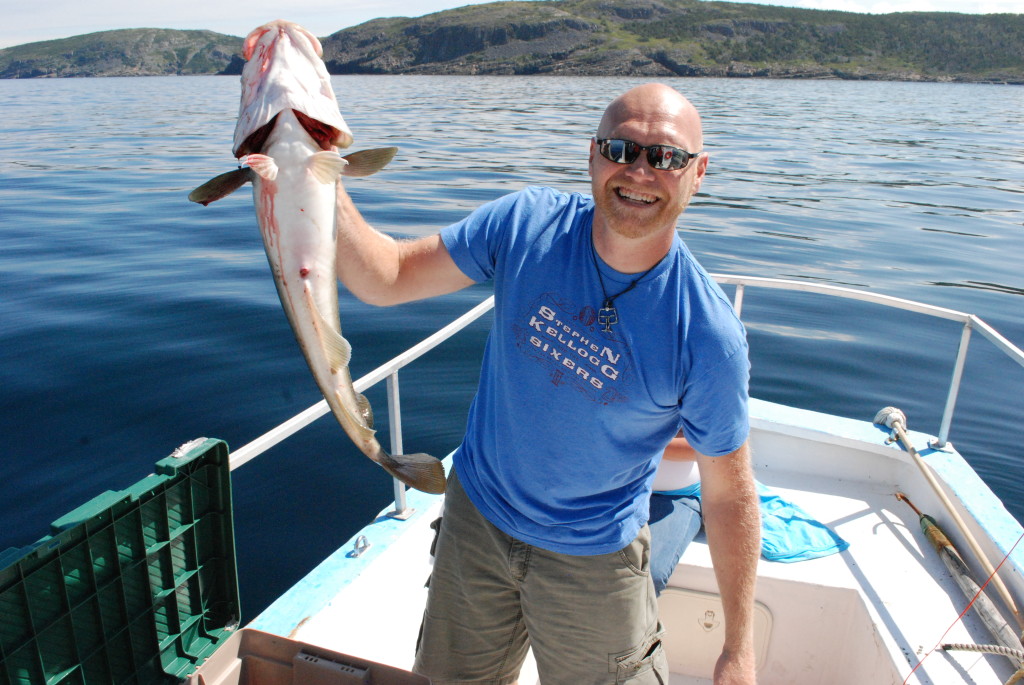 Chef Todd Perrin looking rather happy with a recently caught fish.