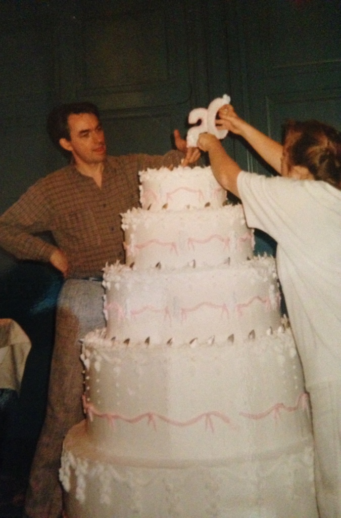 "Donna and I topping off a cake for some company's 20th anniversary. Cake is styro with twinkly lights inset and shortening and sugar frosting. It was an engineering exercise - not catering."