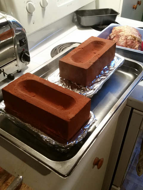 I happened to have a couple of brand new housebricks lying around and they did just the job to press the terrine both during and after cooking.