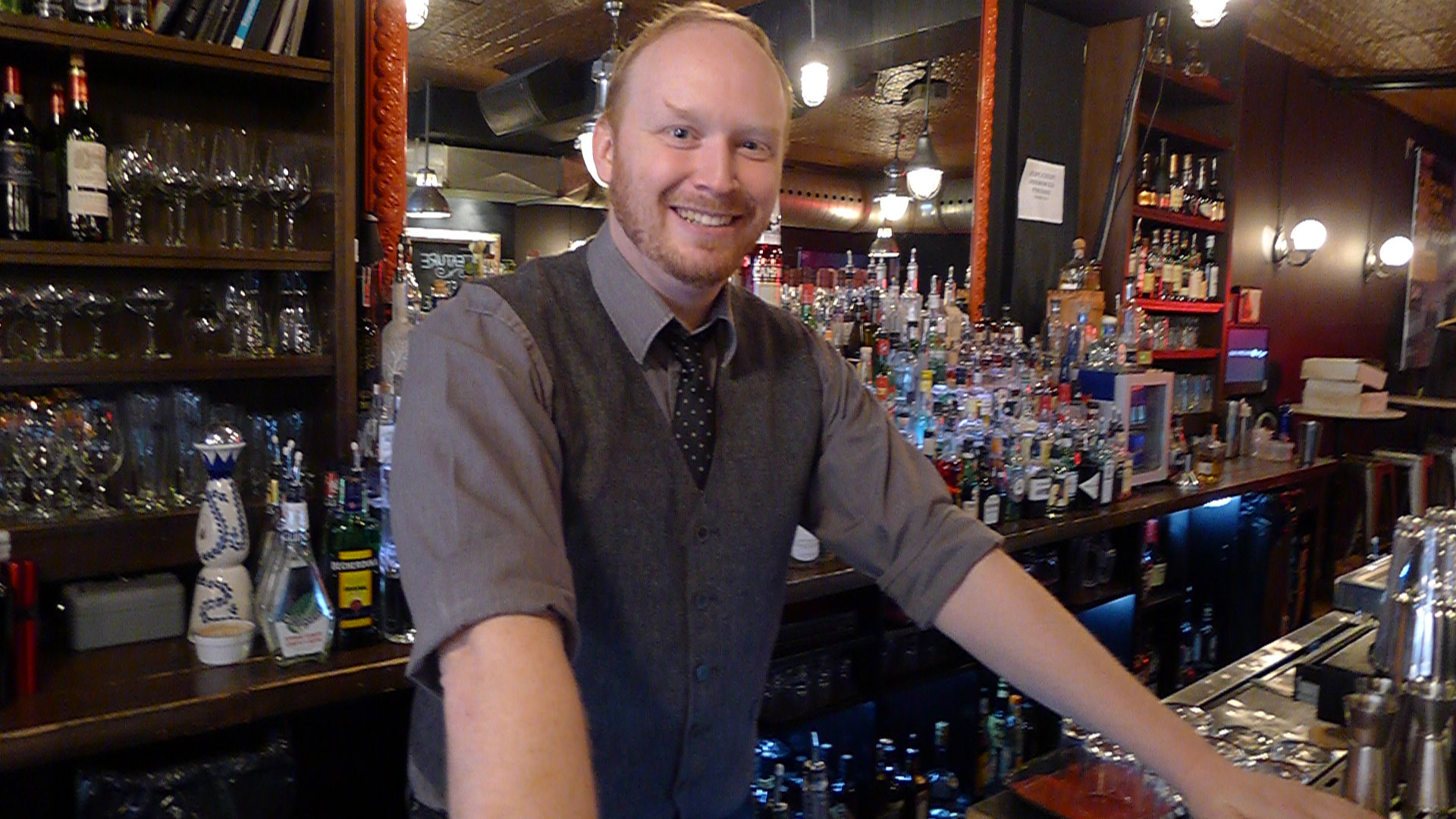 Mixologist and Made With Love's Toronto Ambassador steadies himself behind the wood at College Street Bar.