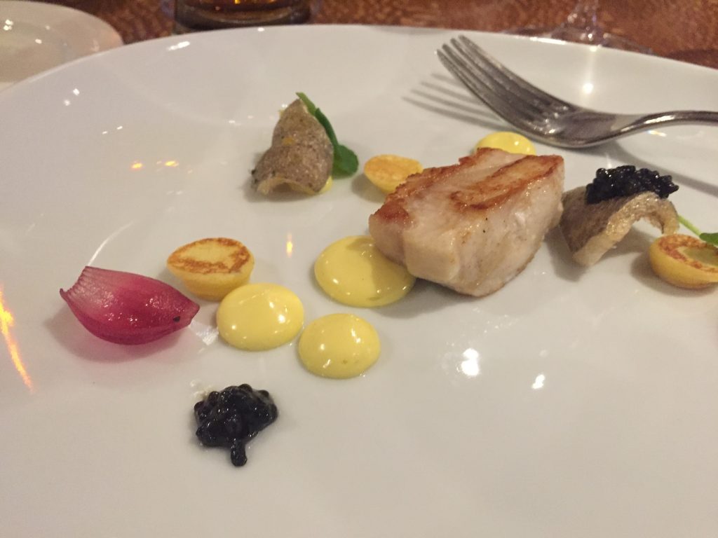 Northern Divine Sturgeon with Sturgeon Chicharon, Caviar, Blinis, Pickled Pearl Onion, and Watercress at the Air Canada Club. All Ocean Wise approved.
