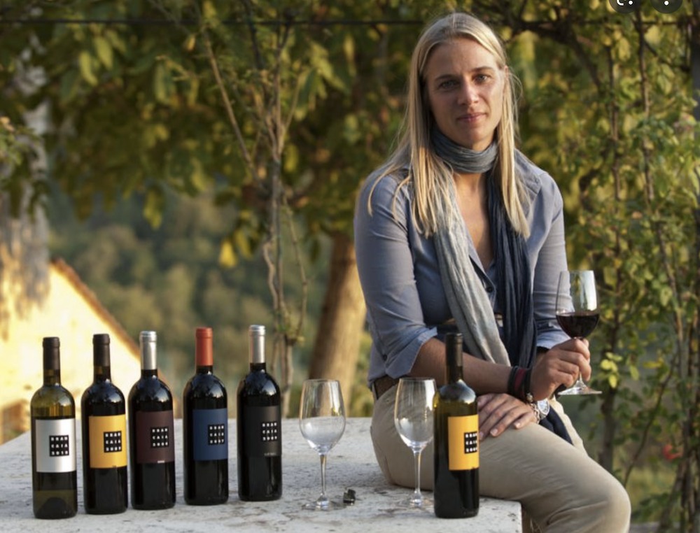 Brancaia's most excellent Barbara Widmer, pictured here at home in the vineyard with a few of her wines.